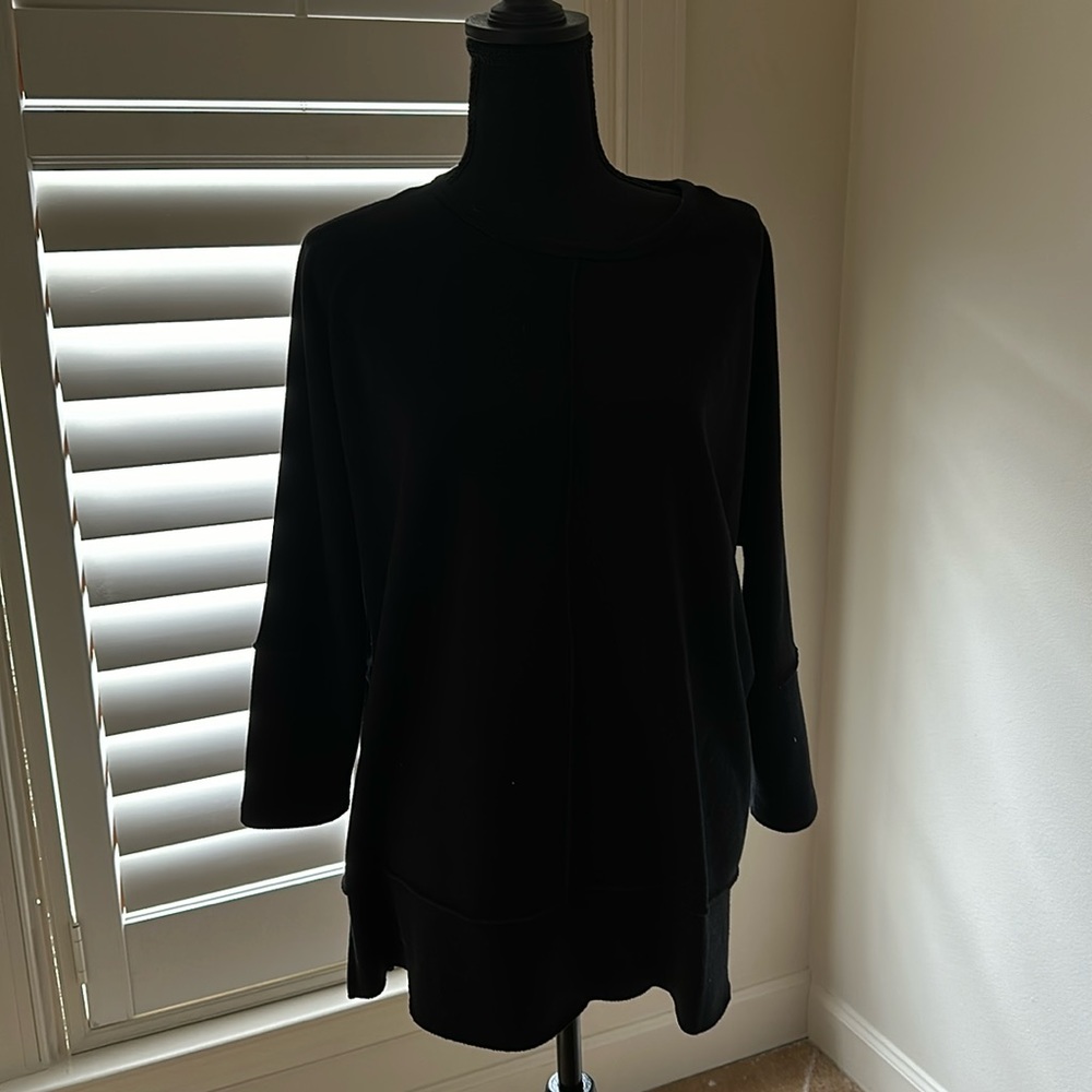 Longer top? Details in front, back, on sleeves,  split on sides.